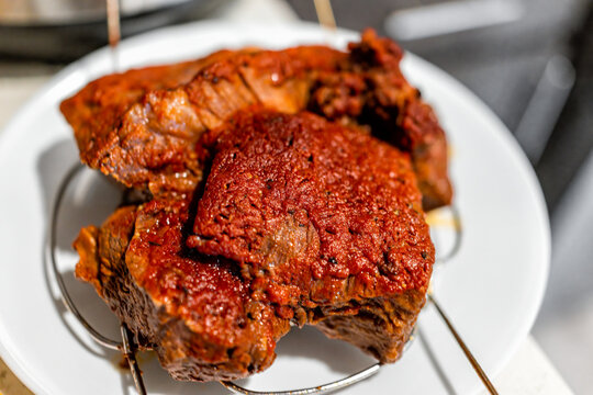 Roasted Chuck Roast Cooked Brown Meat On White Plate Macro Closeup Cooling On Rack As Pile Of Tender Meat