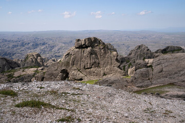 Hiking in the mountains. View of the rocky hills in a sunny day.