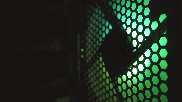 Fan with RGB backlight in a modern powerful computer in the dark. CPU cooling system. 4k loop high quality video. ProRes 422 HQ. Rec 2100 HLG.