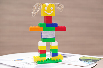 Smiling Toy robot made from toy plastic colorful blocks