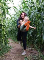 Mom and son have fun in the corn maze