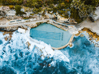 Aerial drone photography shot of the beautiful bronte ocean pool located in sydney, Australia