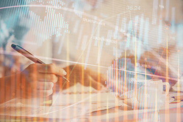 Double exposure of forex graph drawing over people taking notes background. Concept of financial analysis