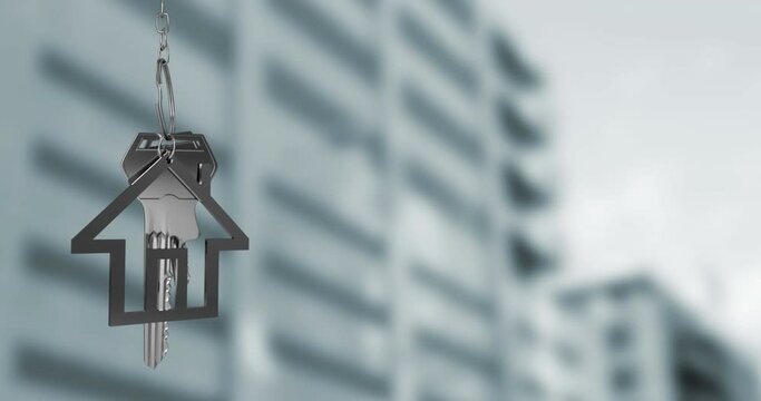 Animation of hanging keys with house keychain against tall building
