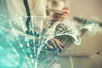 Double exposure of woman hands typing on computer and DNA hologram drawing. Medical education...