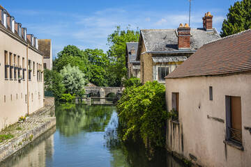 Scenic view of Eure River banks and houses in Historic Center of Chartres. Chartres, Eure-et-Loir...