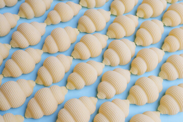 Pasta on a blue background - texture, pattern