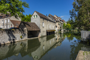 Fototapeta na wymiar Scenic view of Eure River banks and houses in Historic Center of Chartres. Chartres, Eure-et-Loir department, Centre-Val de Loire region, France, Europe.