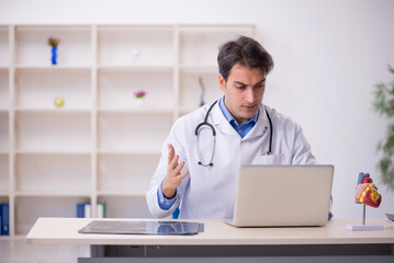 Young male doctor in telemedicine concept