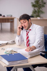 Young male employee working in the office