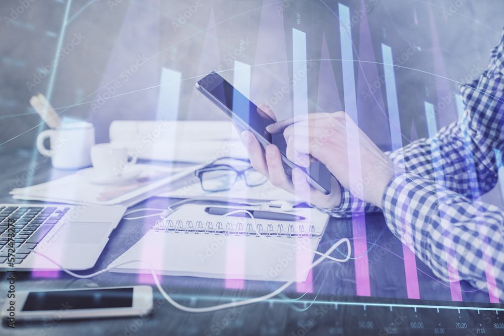Aufkleber double exposure of man's hands holding and using a digital device and forex graph drawing. financial