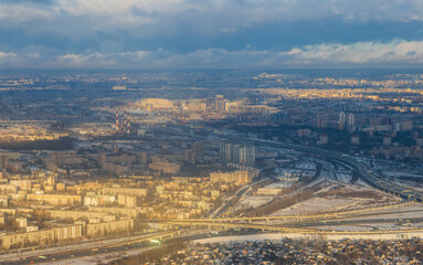 Aerial view of a big city. Top view of city blocks and highways. Cloudy weather. Saint-Petersburg, Russia.