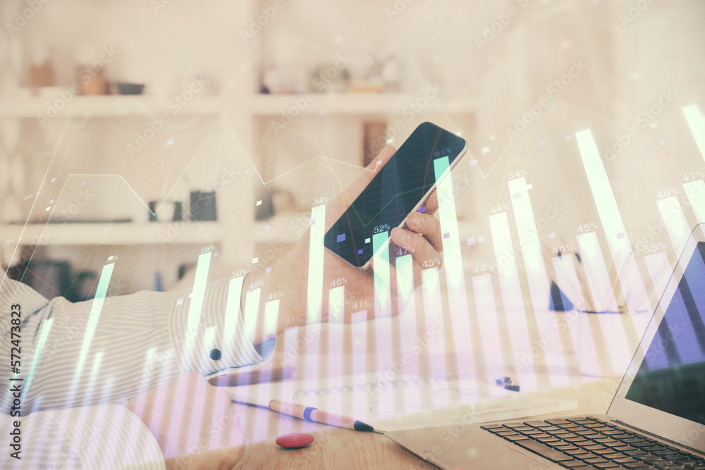 Aufkleber double exposure of man's hands holding and using a digital device and forex graph drawing. financial