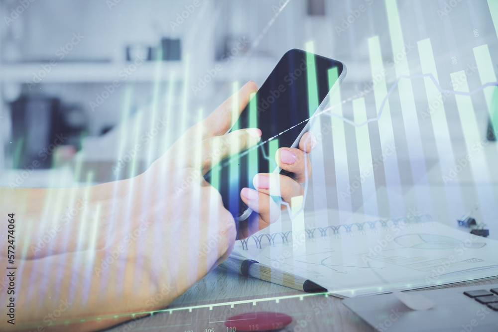 Poster double exposure of man's hands holding and using a digital device and forex graph drawing. financial