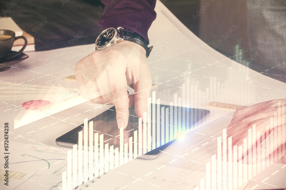 Poster double exposure of man's hands holding and using a digital device and forex graph drawing. financial