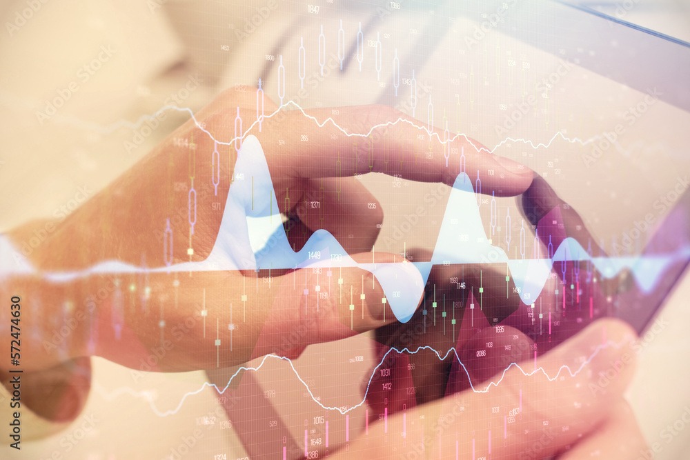 Poster multi exposure of man's hands holding and using a phone and financial chart drawing. market analysis