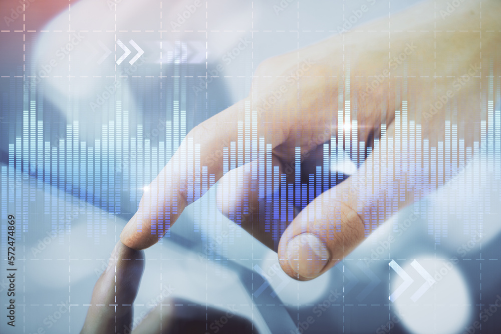 Poster multi exposure of man's hands holding and using a phone and financial chart drawing. market analysis