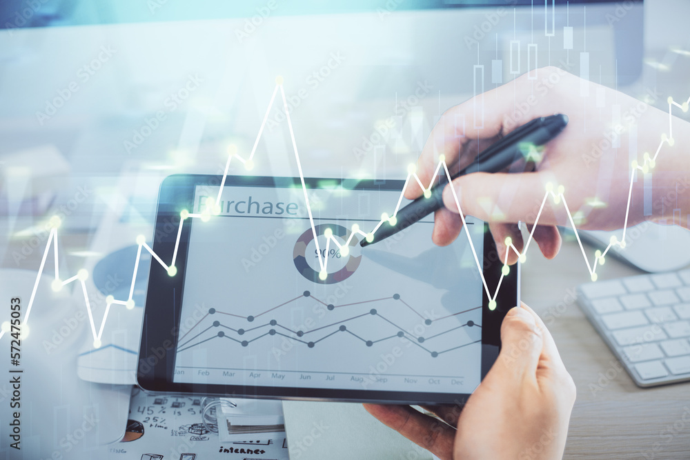 Poster double exposure of man's hands holding and using a phone and financial chart drawing. market analysi