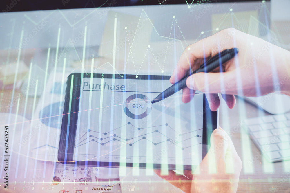 Poster double exposure of man's hands holding and using a phone and financial chart drawing. market analysi