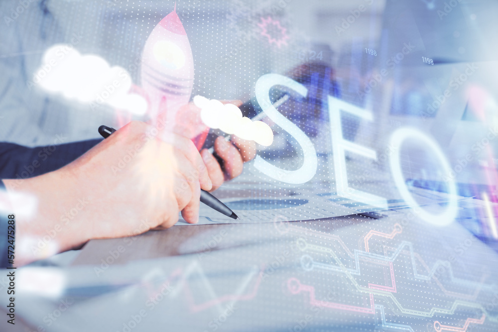 Poster multi exposure of man's hands holding and using a digital device and seo drawing. search optimizatio