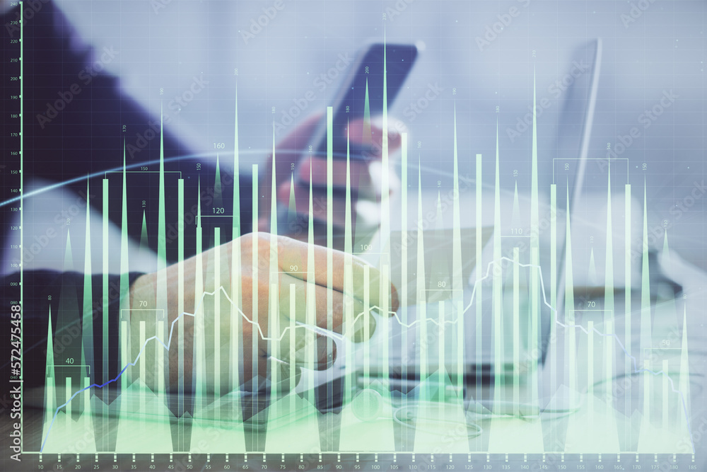 Poster double exposure of man's hands holding and using a phone and financial graph drawing. analysis conce