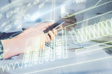 Double exposure of man's hands holding and using a phone and education theme drawing.