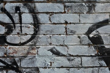 Rough graffiti brick wall for background design.