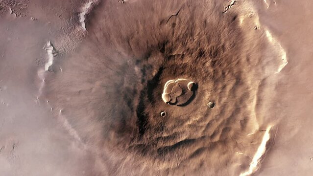 Olympus Mons on Planet Mars, the Largest Volcano in the Solar System with a Height of over 21.9 km (two and a half times the height of Mount Everest). Elements of this Video furnished by NASA.