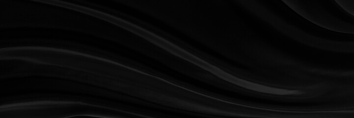Black gray satin dark fabric texture luxurious shiny that is abstract silk cloth panorama background with patterns soft waves blur beautiful.