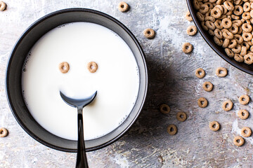 Cereal and milk with a happy face.