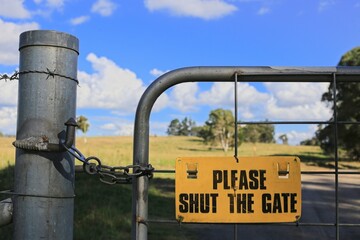 Gunnedah, New South Wales, Australia, 06012022: Please shut the gate sign on a country property.