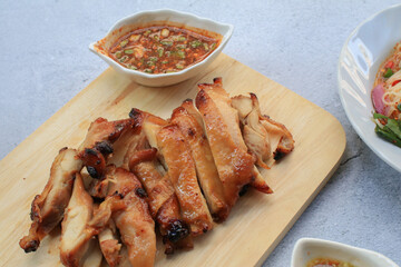 Grilled Pork Neck With Spicy sauce is s Spicy Sour Taste is a Popular Appetizer in Thailand. Thai famous street food