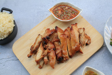 Grilled Pork Neck With Spicy sauce is s Spicy Sour Taste is a Popular Appetizer in Thailand. Thai famous street food