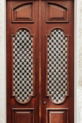 Beautiful typical and wooden door in Tavira, Algarve, Southern Portugal.