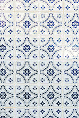 Beautiful wall with typical tiles called azulejo in Tavira, Algarve, Southern Portugal.