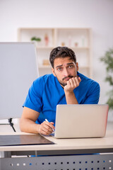 Young male doctor working in the clinic