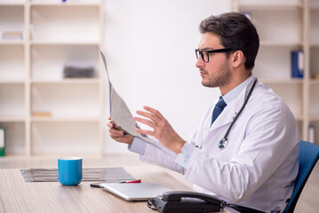 Young male doctor radiologist working in the clinic