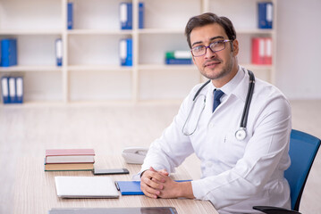 Young male doctor working in the clinic