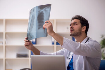 Young male doctor radiologist working in the clinic
