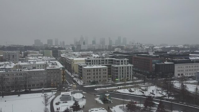 Drone video of warsaw city skyline on a snowy and foggy day3