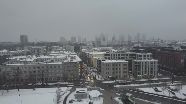 Drone video of warsaw city skyline on a snowy and foggy day 2