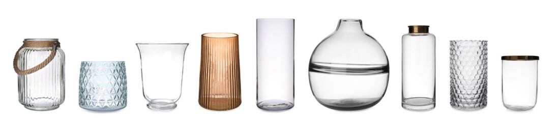 Set of different stylish glass vases on white background