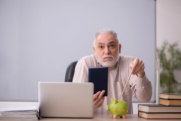 Fototapeta premium Old male teacher in retirement concept