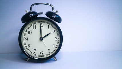 Background photo of an alarm clock showing 2:00, isolated on white background 
