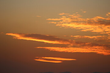 Obraz premium red sunset sky in the clouds, golden hour abstract clouds, orange cumulus cloud