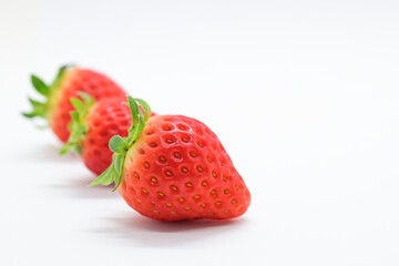beautiful three fresh red strawberry isolated on white background