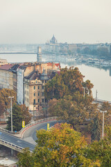 Fototapeta na wymiar Amazing view of Danube river with famous bridges in autumn morning in Budapest, Hungary