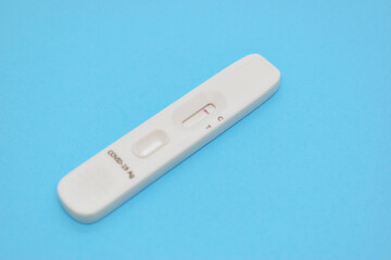 covid test kid on blue background