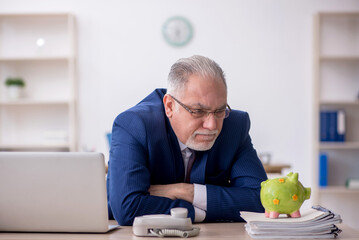 Old male employee in planning retirement concept
