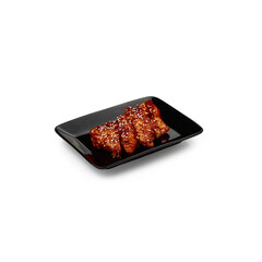 chicken Wings in Chinese on a black plate on a white background isolate